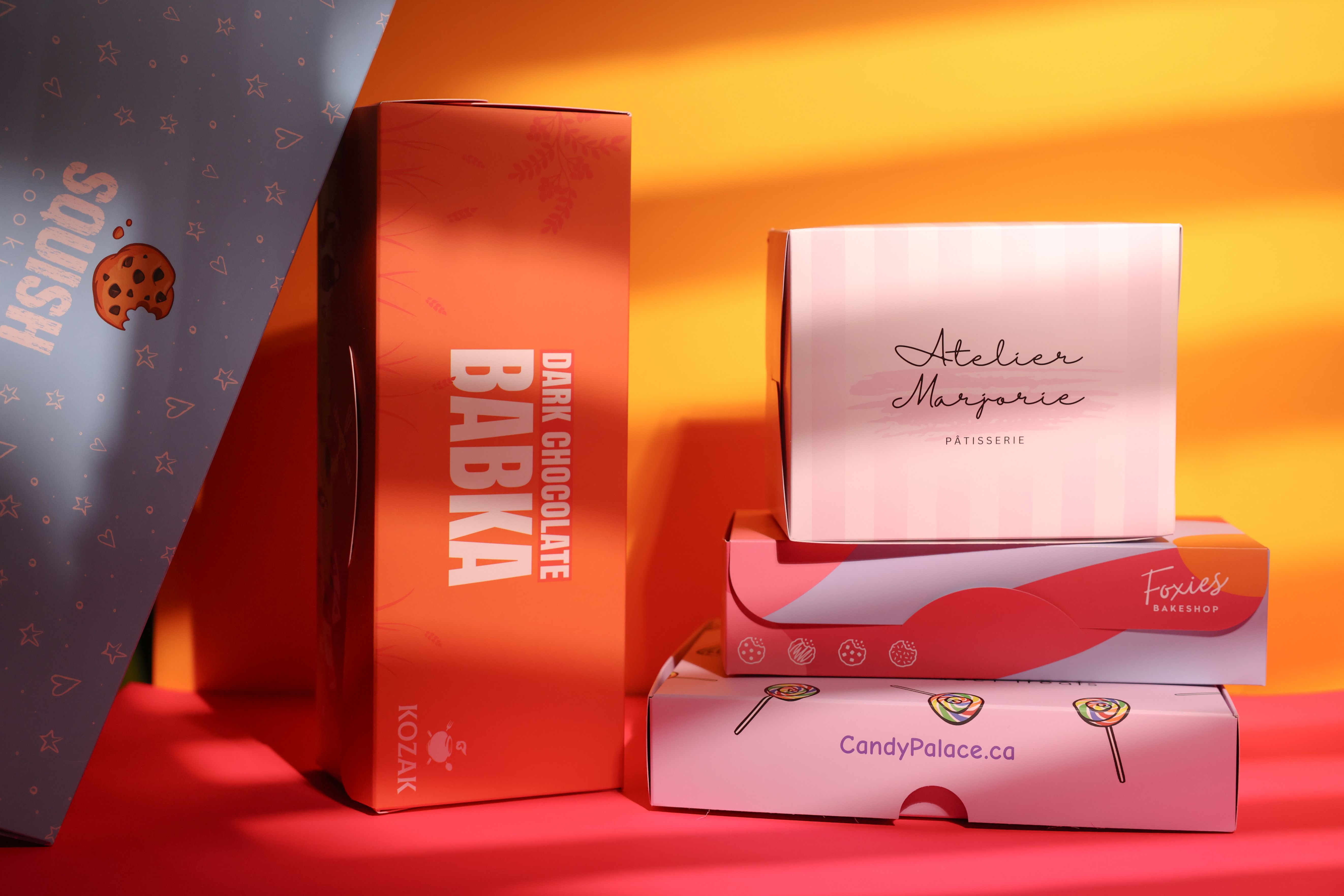 Diverse bakery box designs showcasing branding and packaging potential.